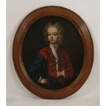 English School, c.1730PORTRAIT OF A YOUNG BOY OF THE FFOLKES FAMILY, HALF LENGTH, IN A RED COAT