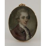 Circle of John Smart (1742/3-1811)PORTRAIT OF A YOUNG GENTLEMAN, BUST LENGTH, IN A PLUM-COLOURED