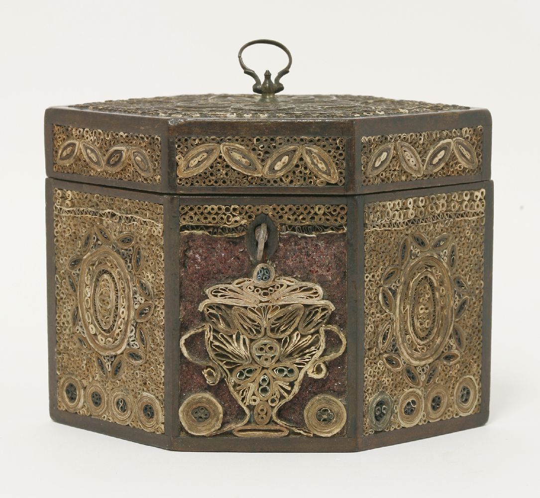 A George III rolled paper filigree hexagonal tea caddy, the front panel with rolled paper urn, now