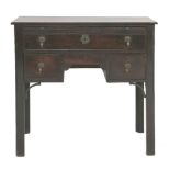 A George III mahogany lowboy, with a brushing slide over a long and two short drawers, a smaller