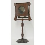 A Victorian mahogany zograscope,with inlaid decoration and raised on a turned adjustable stand,