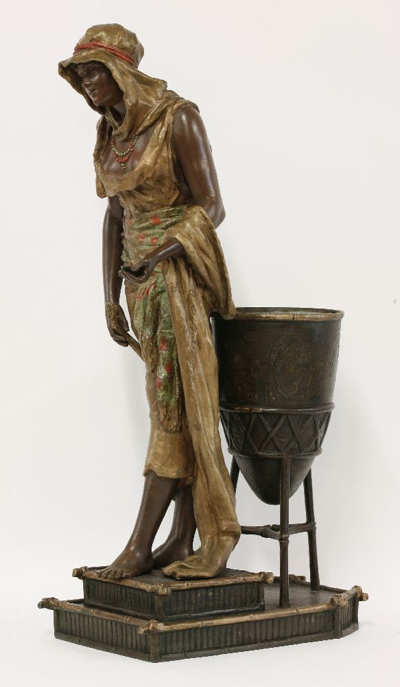 A spelter figure of an Arab girl,standing beside a brazier holding a lute and a dish, signed 'L - Image 2 of 5