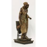 A spelter figure of an Arab girl,standing beside a brazier holding a lute and a dish, signed 'L