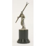 A WMF silver-plated figure of a skier,c.1930, modelled with his bound skis resting upon his right