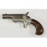 A Colt Derringer .41 calibre pistol,with pivoting barrel engraved 'Colt', and stamped '41 Cal', on