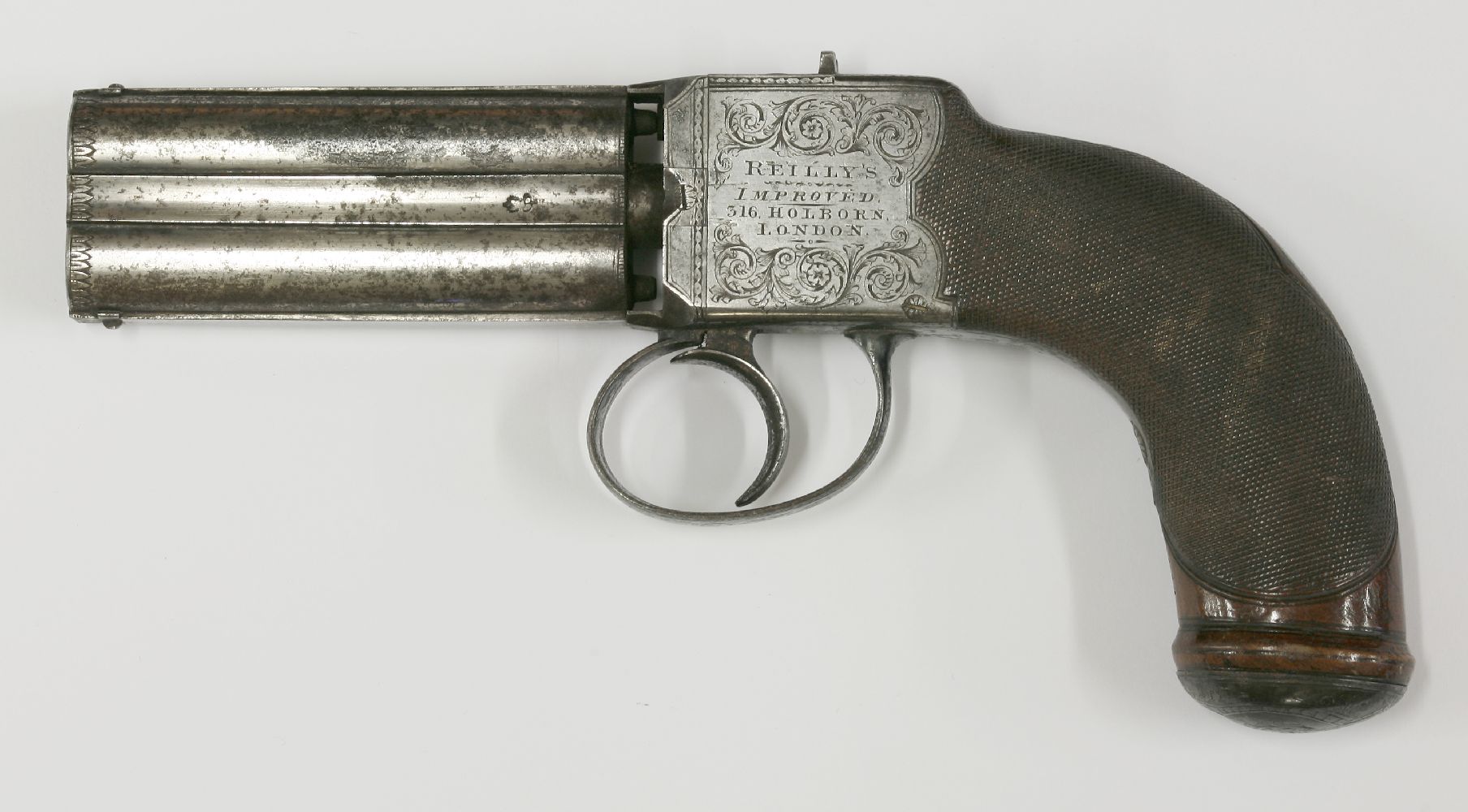 A Reilly's improved turn-over pistol,c.1850, the barrel ends engraved with leaves and with proof