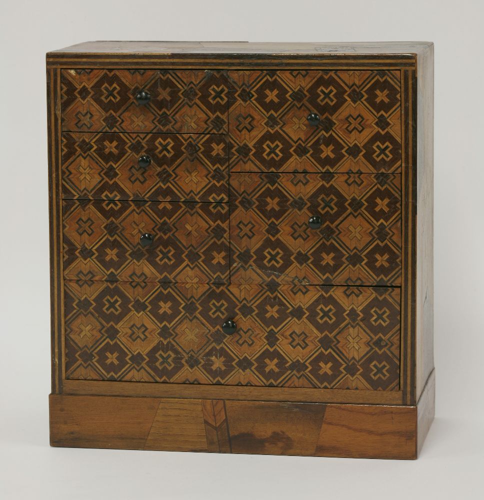 A Japanese parquetry table cabinet,late 19th century, with an arrangement of six drawers, with all-