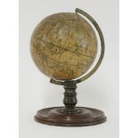 A celestial table globe, 19th century, paper on wood, printed with named signs of the zodiac and