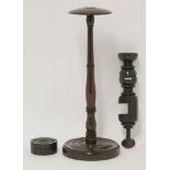 Three treen items, a George III wig stand with applied mother-of-pearl roundel,37cm high,an