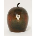 A fruitwood tea caddy,19th century and later, of apple form, now with ivory shield-shaped