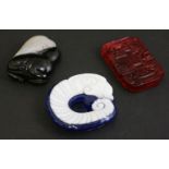 An unusual banded agate Group, 20th century, the black stone base carved as a bear, an eagle on