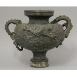 A bronze urn, c.1870, the globular body cast with a gate in a castle, another forming in the sky,