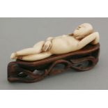 An ivory Doctor's Model, 18th century, the recumbent female, her head resting on her left hand,