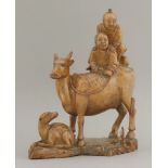 An attractive hardwood Group, 18th century, of two boys, one riding piggyback on his companion and