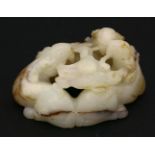 A jade scroll Weight, early 20th century, attractively carved as three goats, their breath forming