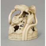 A walrus ivory Seal, second quarter of the 19th century, carved and pierced with a toad, snail and