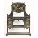 An American Aesthetic ebonised cabinet, by Kimbel and Cabus, New York, the top with a spindle