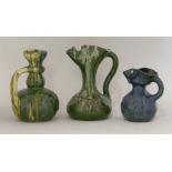 Three Elton 'Sunflower' pottery jugs,each incised with flowers and with trailing glazes, all with