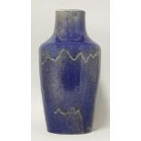 A large stoneware vase,probably Ruskin, with a mottled streaky cream and blue/purple glaze,