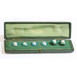 A cased set of six sterling silver buttons,by Liberty & Co., each button with a blister pearl centre