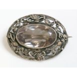 A silver Arts and Crafts single stone quartz brooch,attributed to Dorrie Nossiter.  A near