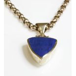 A 9ct gold reversible lapis lazuli and mother-of-pearl pendant,on a gold belcher chain, the