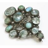 An Arts and Crafts silver and gemstone brooch,attributed to Dorrie Nossiter.  A lozenge shaped