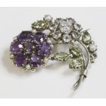A late Arts and Crafts silver spray brooch,attributed to Dorrie Nossiter, with clusters of gemstones