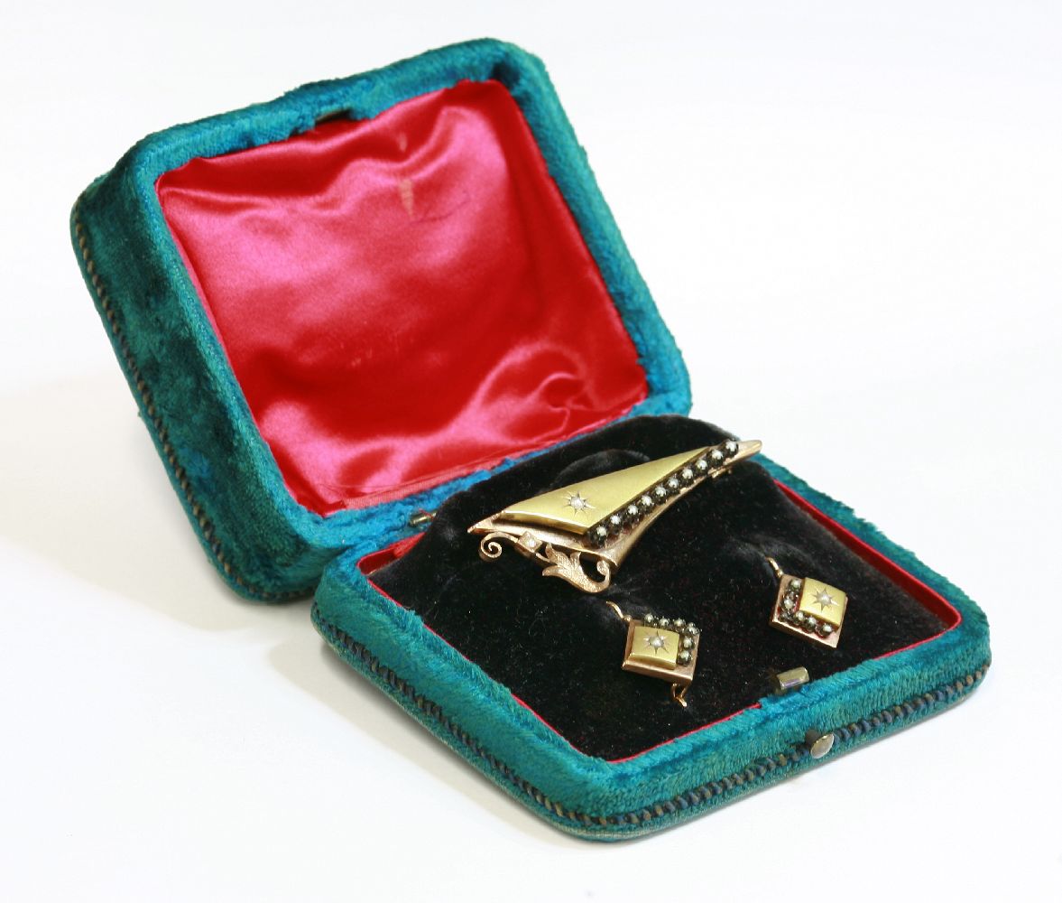 A Continental, cased, Victorian, two colour gold brooch and earring split pearl suite,an elongated