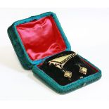 A Continental, cased, Victorian, two colour gold brooch and earring split pearl suite,an elongated