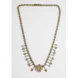 A late Victorian gold fringe necklace set with split pearls, c.1900,a twin heart centrepiece with