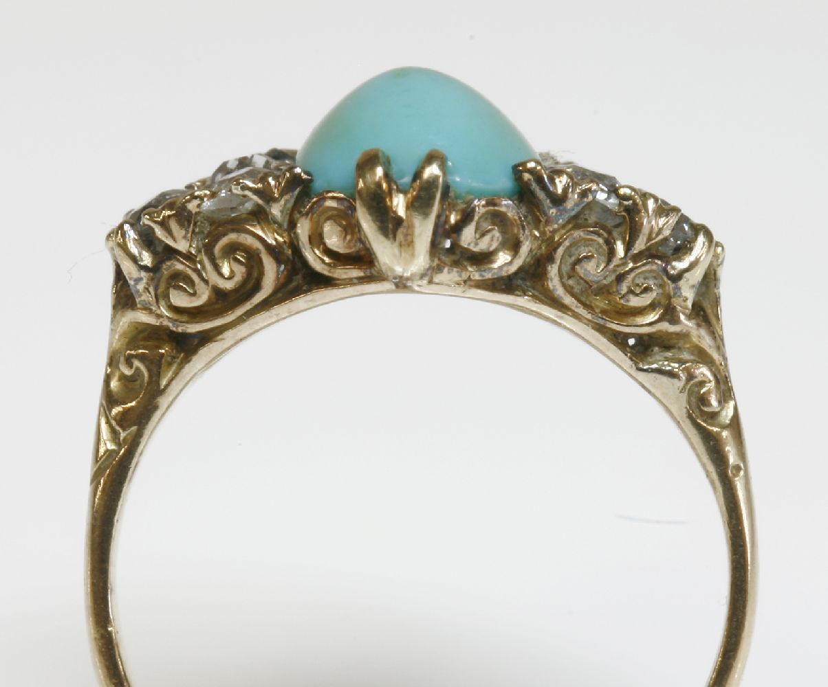 A late Victorian turquoise and diamond carved head ring,with an oval cabochon turquoise, claw set to - Image 2 of 2