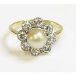 A pearl and diamond daisy cluster ring,early 20th century, with a cream pearl peg set to the centre.