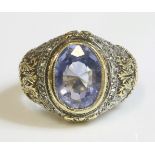 A gentlemen's gold and silver sapphire and diamond ring,possibly Russian, with an oval mixed cut