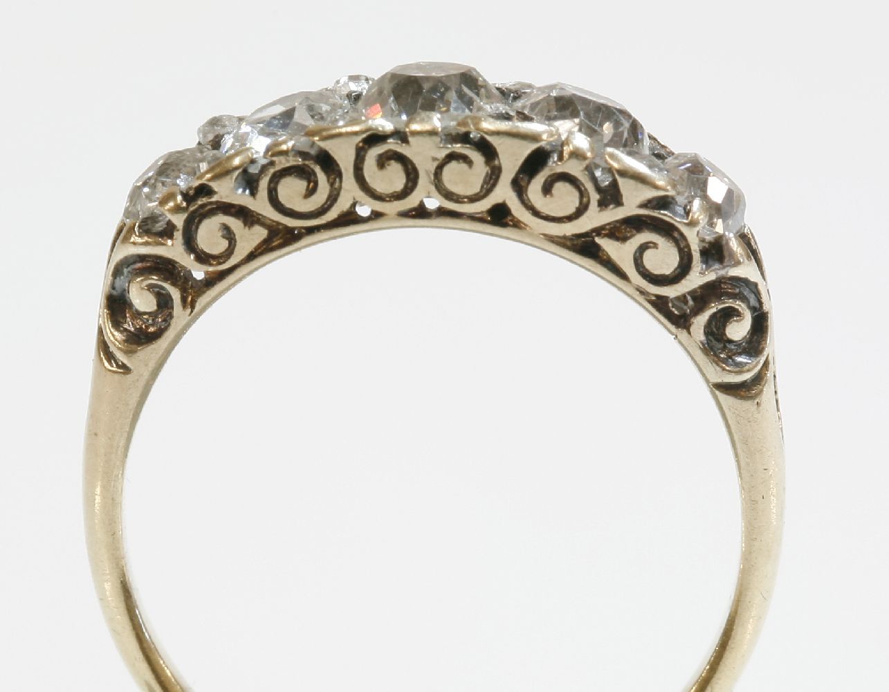 A late Victorian five stone diamond carved head ring with diamond set points,five graduated - Image 2 of 2
