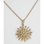 A late Victorian diamond and split pearl gold starburst brooch pendant, c.1900.An India star with an