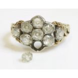 A Victorian nine stone diamond daisy cluster ring with diamond set shoulders,a seven stone diamond