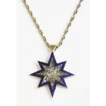 A diamond and enamel Indian star pendant,with a central cushion cut diamond, with graduated Swiss
