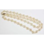 A single row cultured pearl necklace,with a 9ct gold safety clasp, a single row of uniform