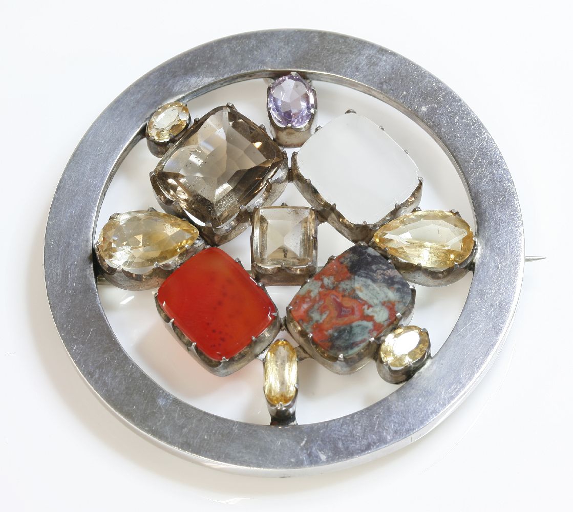 A Scottish hardstone plaid brooch,of circular form with a flat section frame.  Four hardstone