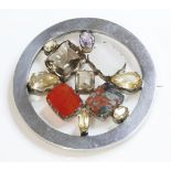 A Scottish hardstone plaid brooch,of circular form with a flat section frame.  Four hardstone