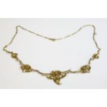A French Art Nouveau gold and pearl necklace,with a centrepiece of graduated open panels.  The