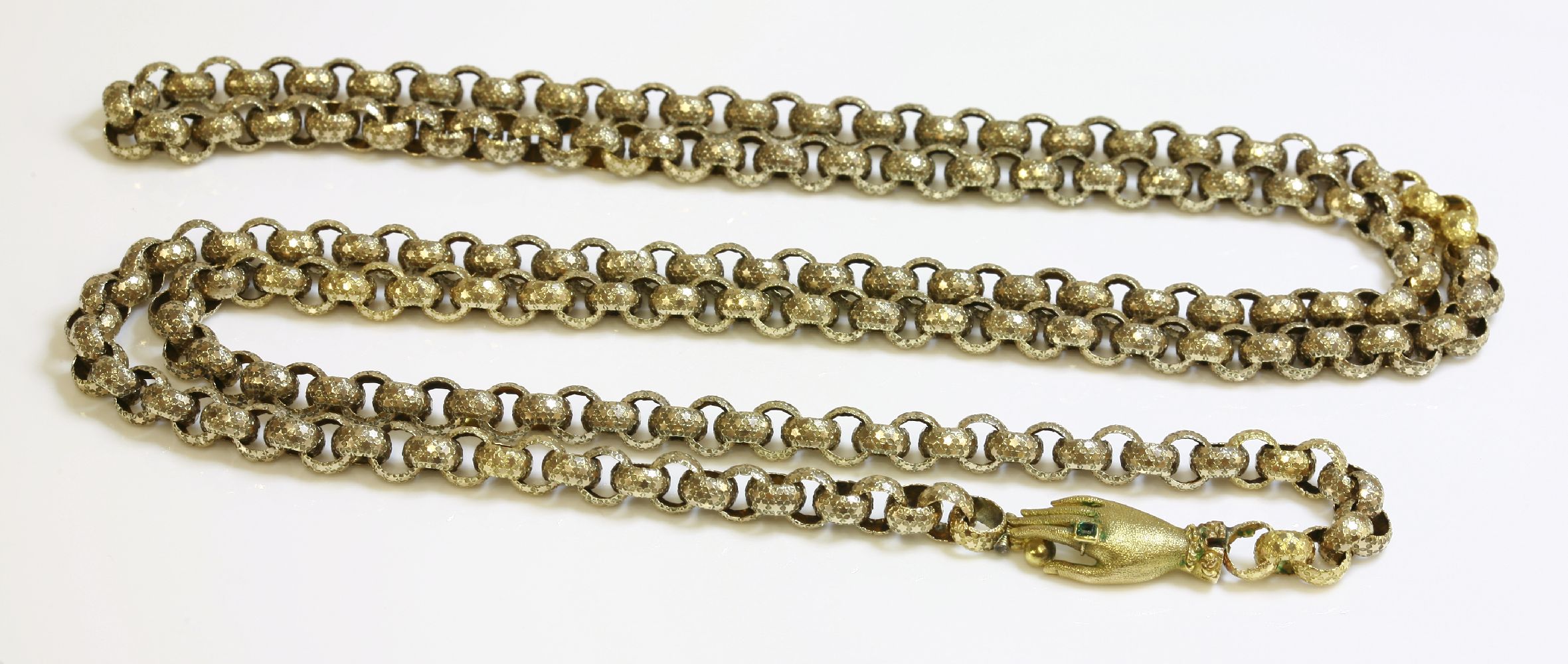 A Georgian gold long chain,with a gem set hand clasp, with belcher links decorated with raised