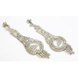 A pair of Art Deco diamond set drop earrings,with a series of graduated pierced and articulated