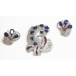 An American sapphire, ruby and diamond brooch/pendant, and matched earring suite, c.1950,the spray