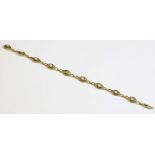 A French gold and pearl set bracelet, c.1900,with a series of marquise shaped twisted wire plaque