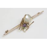 A late Victorian amethyst, demantoid garnet and blister pearl spider brooch, c.1900,the flat section