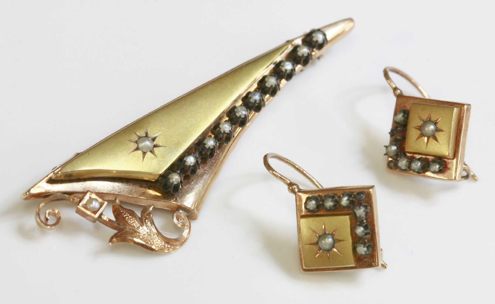 A Continental, cased, Victorian, two colour gold brooch and earring split pearl suite,an elongated - Image 2 of 2