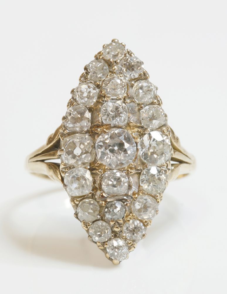 An Edwardian diamond set marquise shaped cluster ring,with graduated old European cut diamonds,