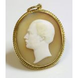 A Victorian carved shell cameo,of a gentleman facing left, in white to a buff ground, a rub over
